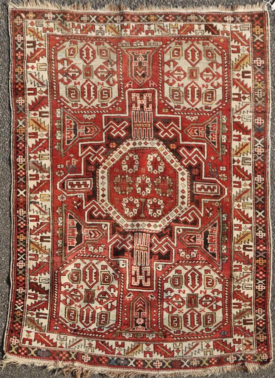 A Shirvan red ground rug, c.1890, 5ft 2in by 3ft 11in.